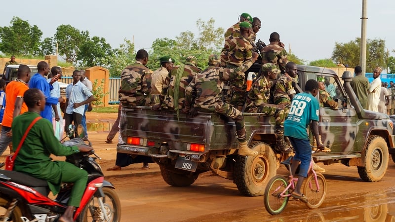 Police take security measures as coup supporters gather for a demonstration in front of the French base in Niamey