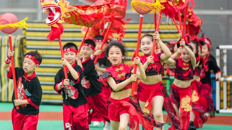 Children perform a dragon dance at a school to welcome the Dragon Boat Festival in Huzhou (File pic)