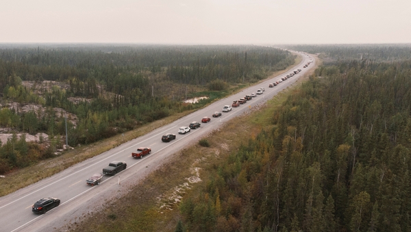 People leave Yellowknife after an evacuation order was issued