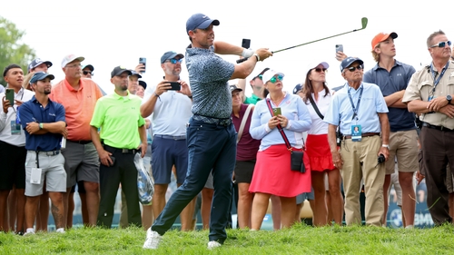 Rory McIlroy plays his approach on 17