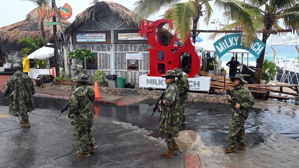 Members of the Mexican Navy patrol the Medano beach before the arrival of hurricane Hilary at Los Cabos resort in Baja California state, Mexico