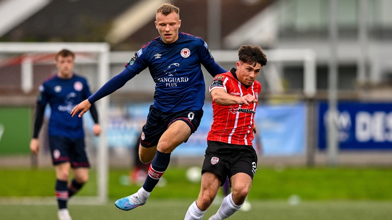Adam O'Reilly of Derry City in action against Jamie Lennon