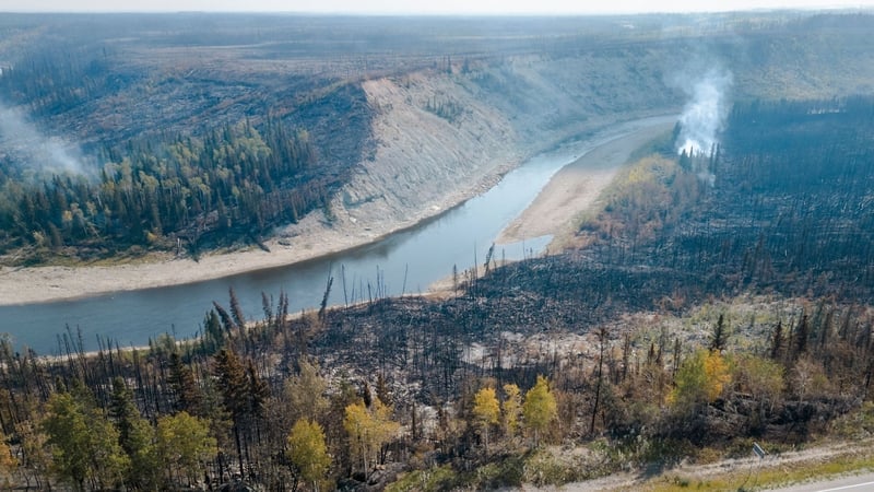 Charred remains on the side of the road beside the highway in Enterprise, Northwest Territories, Canada