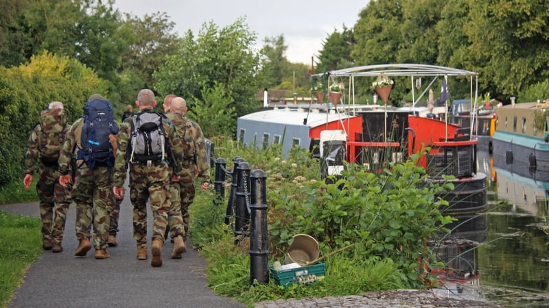 Defence Forces personnel begin their march along the Royal Canal in Dublin