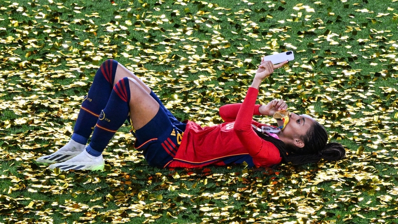 Spain's Salma Paralluelo lies on the pitch after winning the World Cup