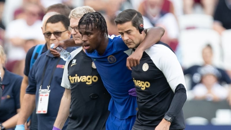 Carney Chukwuemeka is helped off the field during Chelsea's loss to West Ham