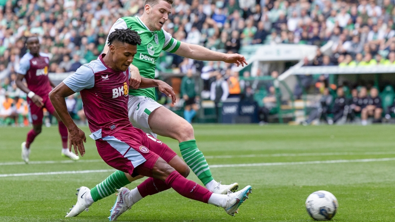 Hibernian's Paul Hanlon closes down Ollie Watkins
