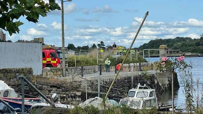 Emergency services are seen at the scene in Passage West in 2023