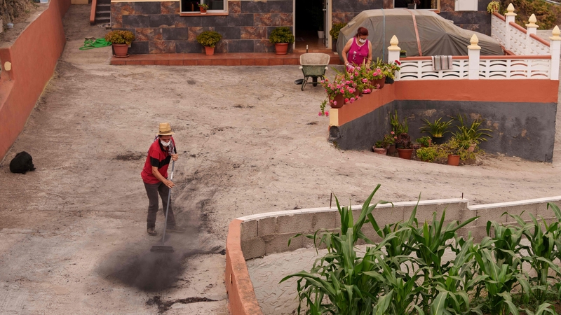A resident cleans his house of ash after returning to his home in Los Realejos on the Canary island of Tenerife