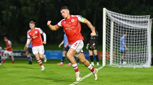 Joe Redmond wheels away after opening the scoring at UCD Bowl