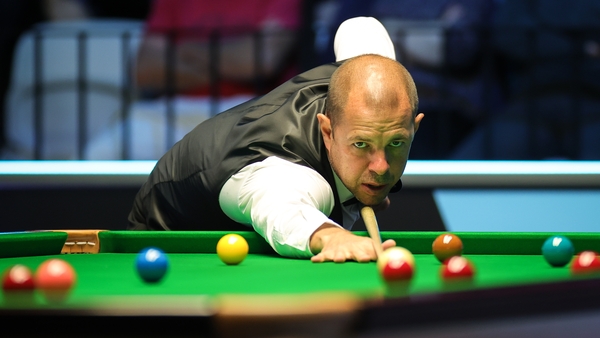 Barry Hawkins plays a shot against Luca Brecel at the European Masters
