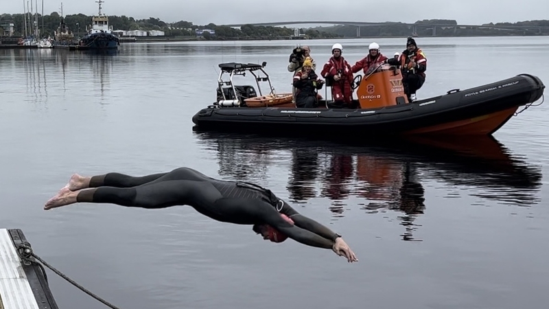 Danny Quigley dives in for the last leg of his 110km swim