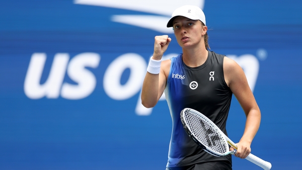 Iga Swiatek celebrates an opening win in New York