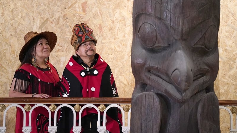 Earl Stephen's (who has the Nisga'a cultural name Chief Ni'is Joohl) with Pamela Brown beside the 11-metre tall memorial pole ahead of its return to British Columbia