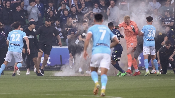 A bucket filled with sand strikes Tom Glover of Melbourne City