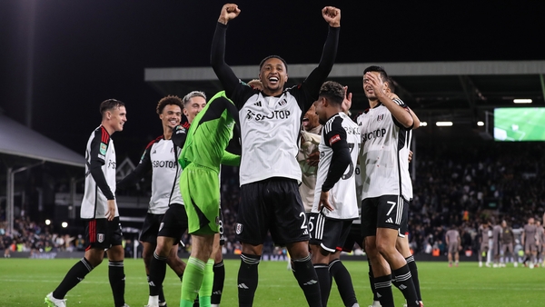 Kenny Tete celebrates his winning spot-kick