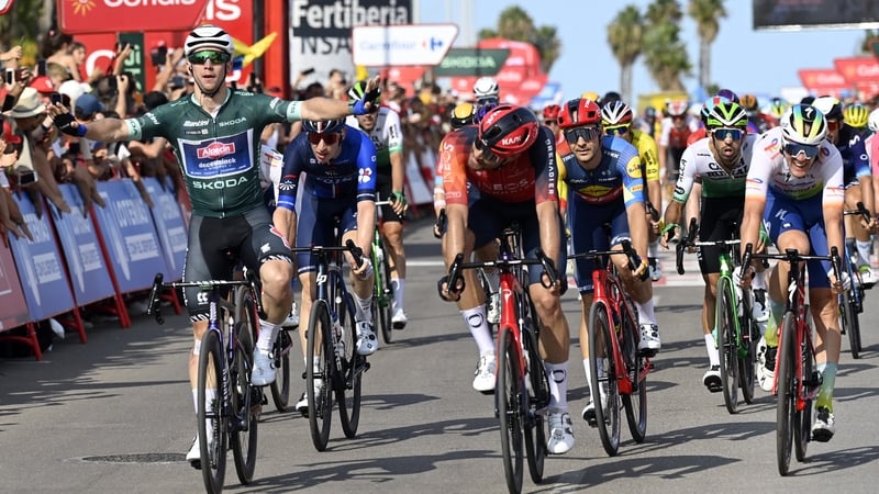 Team Alpecin's Australian rider Kaden Groves crosses the line first, followed by Filippo Ganna (centre)