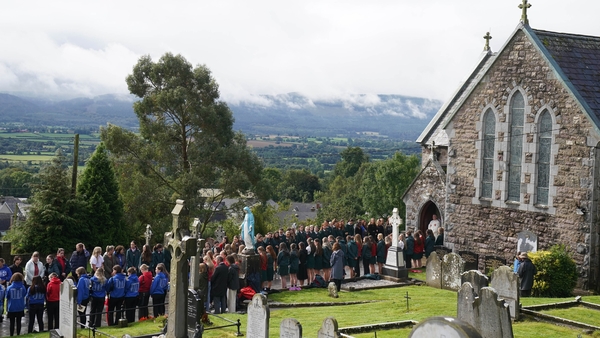 Mourners attend the funeral of Nicole Murphy
