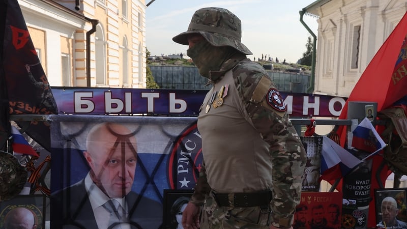A man wearing Wagner Group PMC insignia walks past a memorial to Yevgeny Prigozhin in Moscow this week