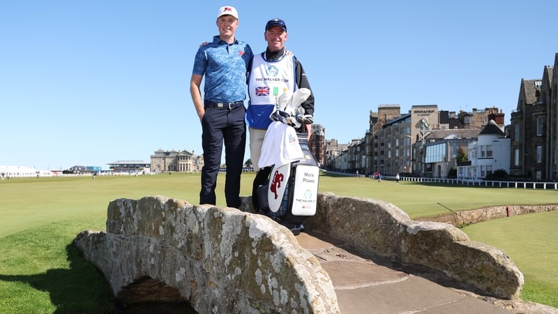 Mark Power poses with his caddie on the iconic Swilcan Bridge at St Andrews Old Course ahead of the Walker Cup
