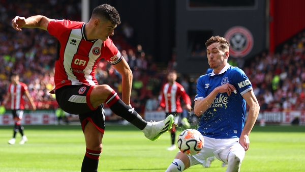 John Egan (L) in action against Everton's James Garner