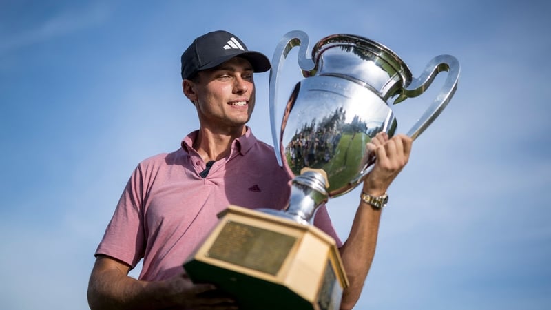 Ludvig Aberg poses with the trophy