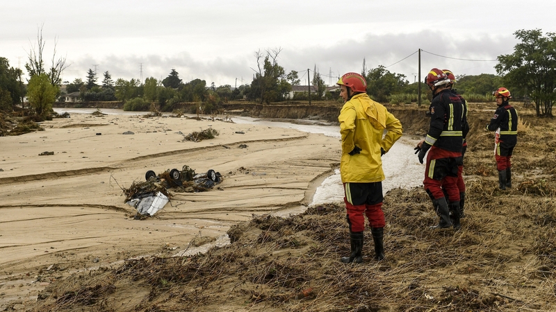 Cars were stranded on a river bank in the town of Aldea del Fresno after the rain