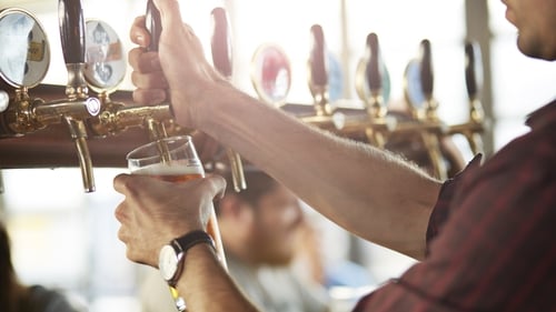 A banker who spent decades moonlighting as a barman ended up being sacked twice in one year after a manager at AIB read about his unfair dismissal from his after-hours pub job in a news report