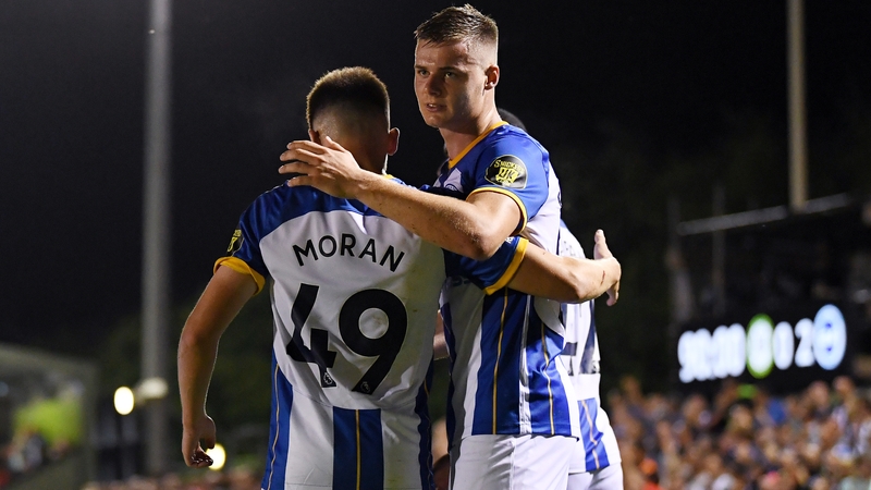 Evan Ferguson (R) and Andy Moran celebrate a Brighton goal last season