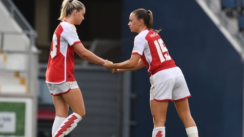 Katie McCabe (R) consoles Arsenal team-mate Alessia Russo her miss in the penalty shoot out
