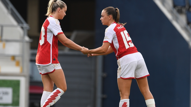 Katie McCabe (R) consoles Arsenal team-mate Alessia Russo her miss in the penalty shoot out