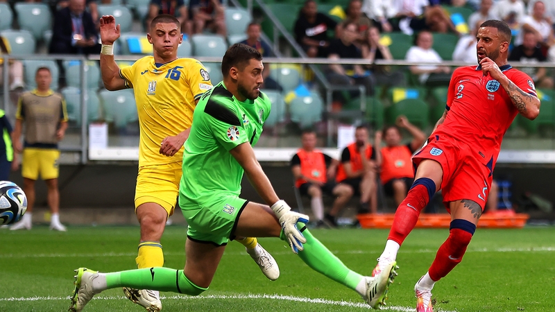 Kyle Walker scores for England past Georgiy Bushchan of Ukraine