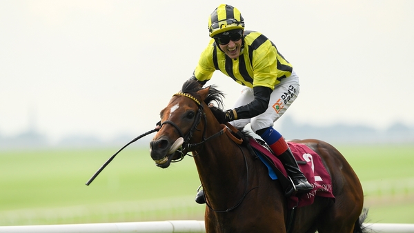 A beaming David Egan crosses the finish line on Eldar Eldarov