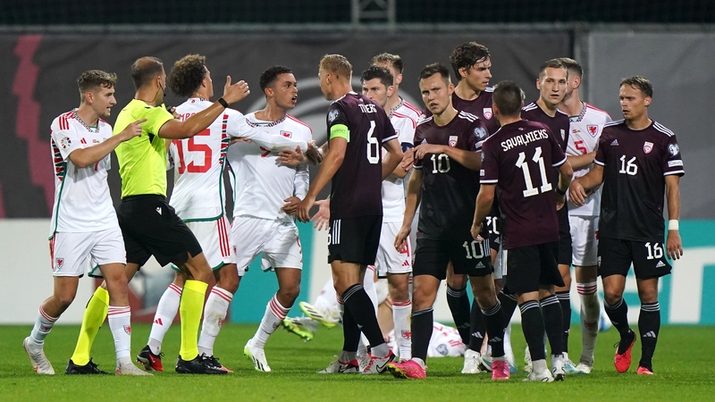 Tempers flare between Wales' Brennan Johnson and Latvia's Kristers Tobers