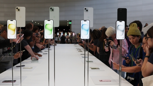 Attendees look at brand new Apple products