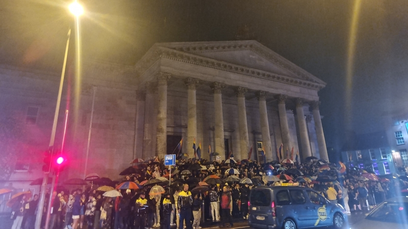 The protesters gathered across the road from Chambers Bar on Washington Street last night