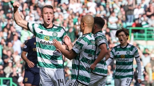 Celtic's David Turnbull celebrates scoring his penalty