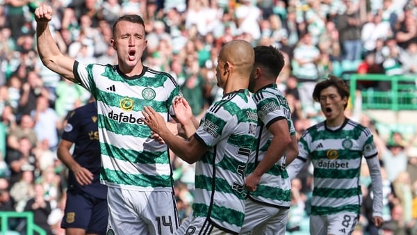 Celtic's David Turnbull celebrates scoring his penalty
