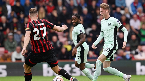 Cole Palmer of Chelsea runs with the ball whilst under pressure from Illya Zabarnyi