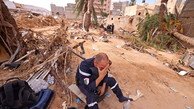 A member of the Algerian Rescue Team reacts as he assists in relief work in Libya's eastern port city of Derna