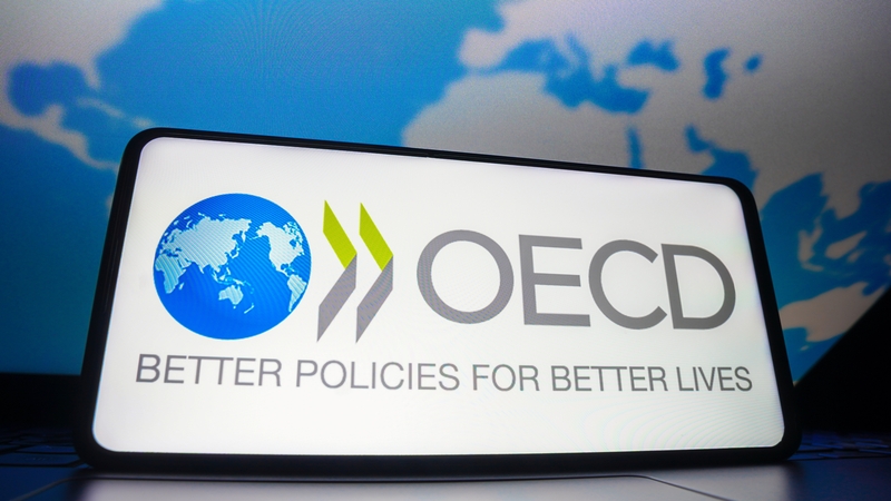 The OECD has cut its global economic outlook and warned that a broader trade war would sap growth further