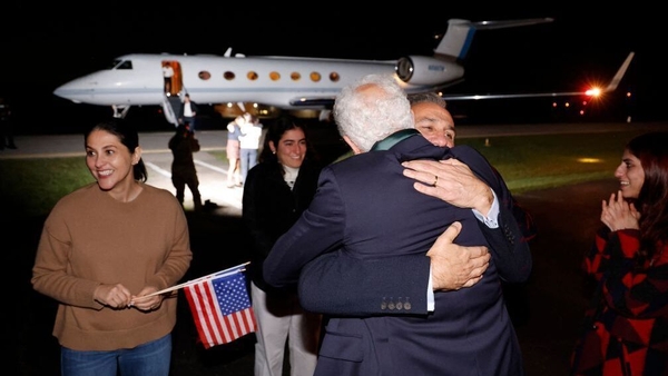 Emad Shargi greets a family member on his return to the US