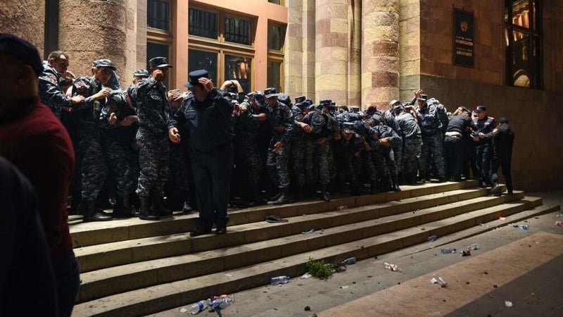 Police guard the entrance to the government building in Yerevan