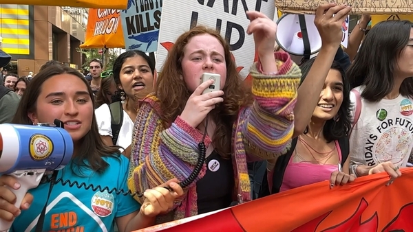 Irish activist Saoirse Exton (C) at a climate protest in New York