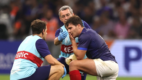 Antoine Dupont receives treatment following head contact with Nambia's Johan Deysel