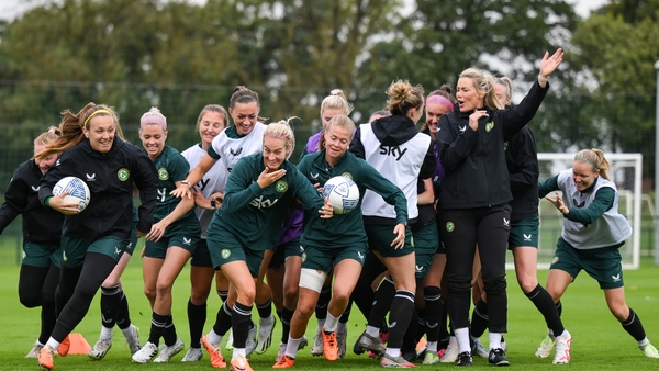 Players go around interim assistant coach Emma Byrne as part of a warm-up drill on Tuesday