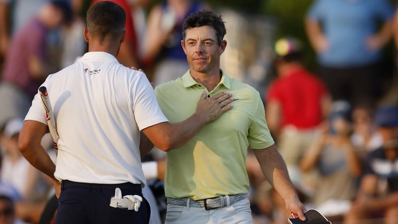 Wyndham Clark, left, and Rory McIlroy shake hands at the Tour Championship last month
