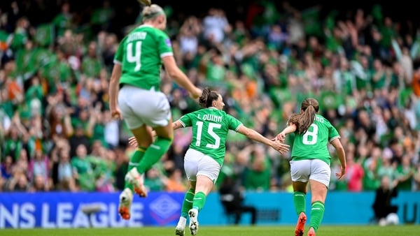 Lucy Quinn (C) wheels away in celebration after her goal