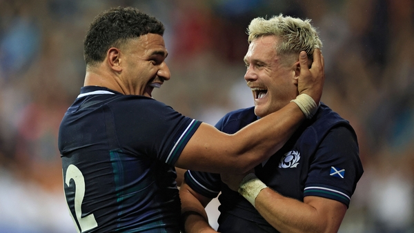 Darcy Graham (R) put the icing on the cake for Scotland with the seventh and final try