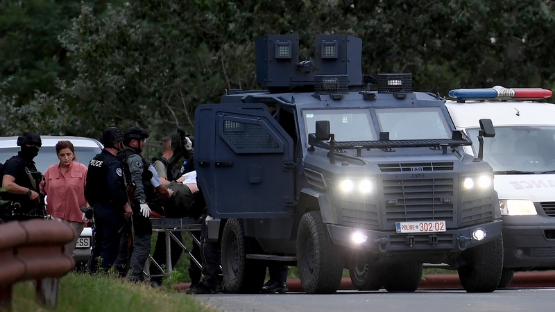 Kosovo police officers evacuate an injured person at the entrance of the village of Banjska, northern Kosovo